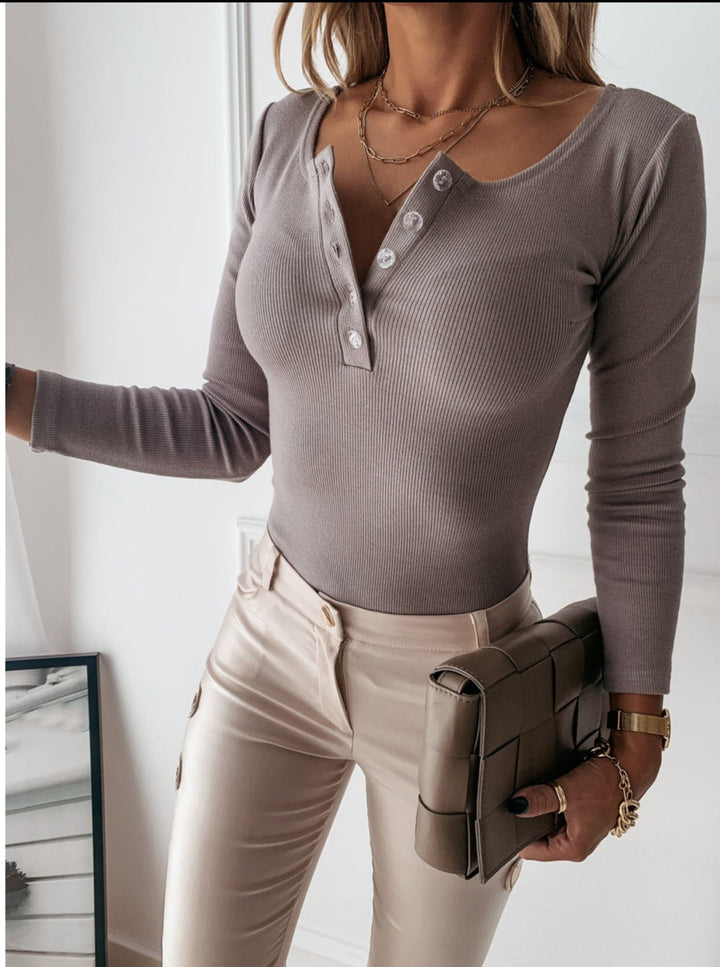 Fashionable women's long sleeve button-front top; slim fit design for chic everyday fashion.