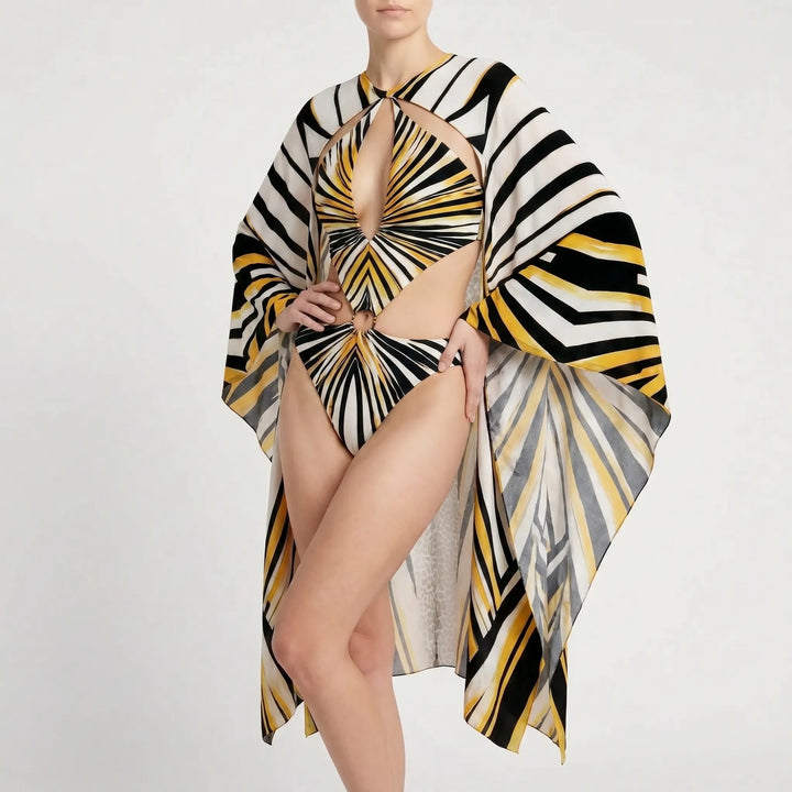 Unique women's long-sleeve printed monokini with elegant cutouts, perfect for a chic vacation outfit.