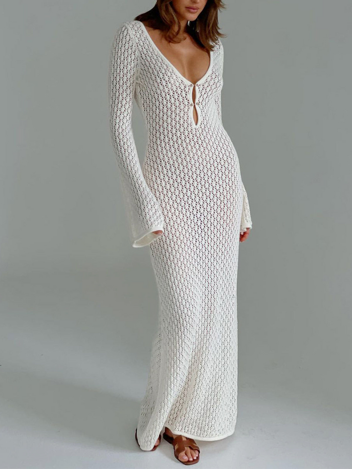 Women's long white beach dress with elegant V-neck and stylish back cutout, perfect for summer vacations.