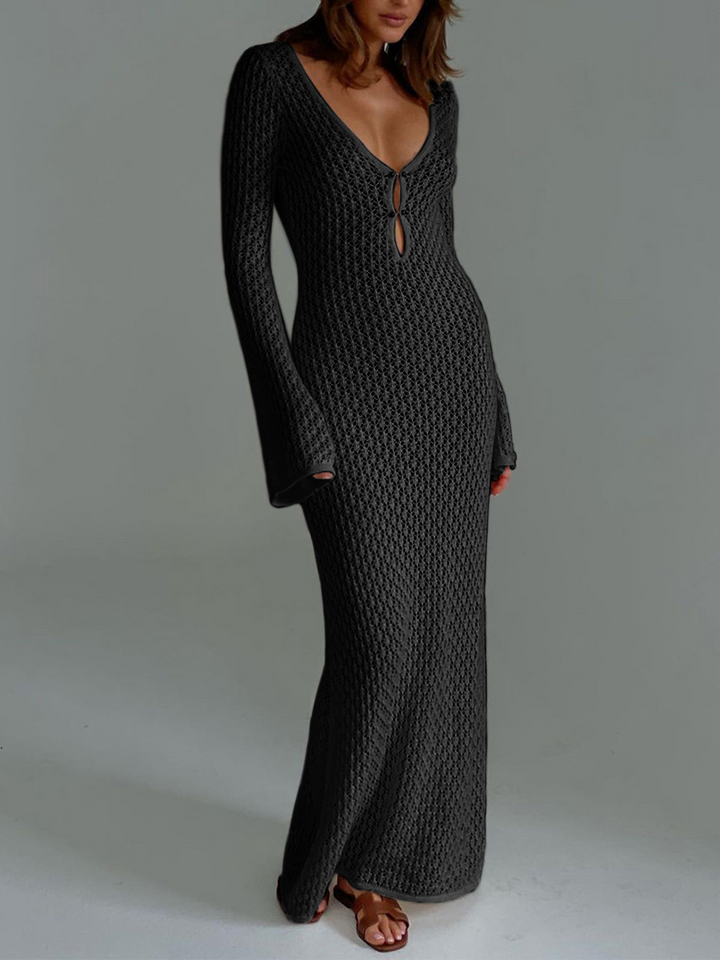 Comfortable women's summer fashion: a long white beach dress with a V-neck and chic back cutout.