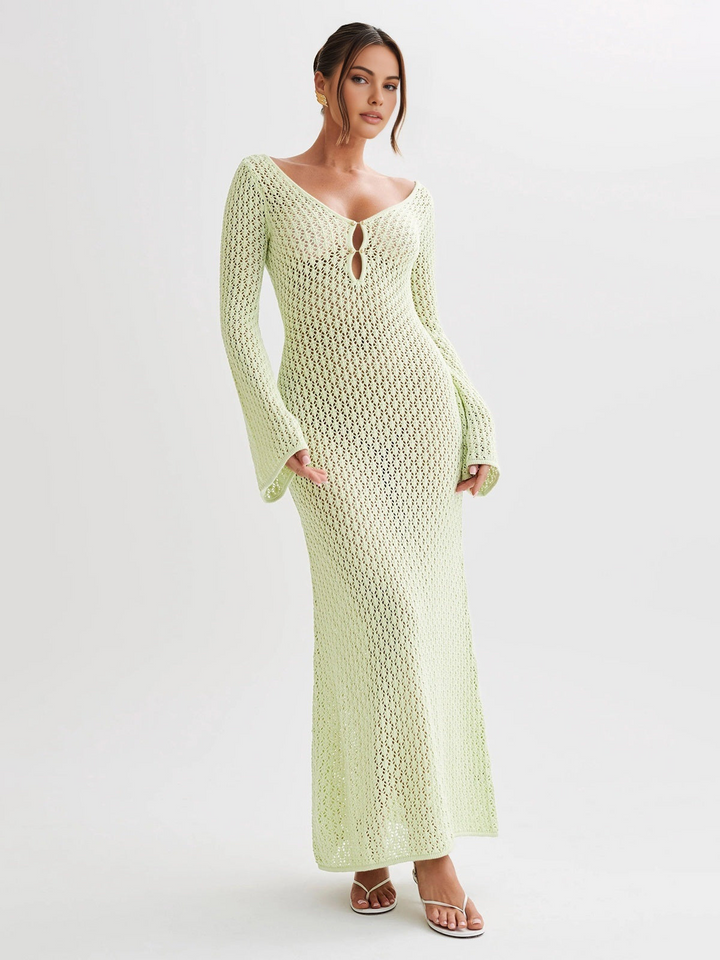 Vacation-ready long beach dress for women, white with a deep V-neck and unique back cutout design.