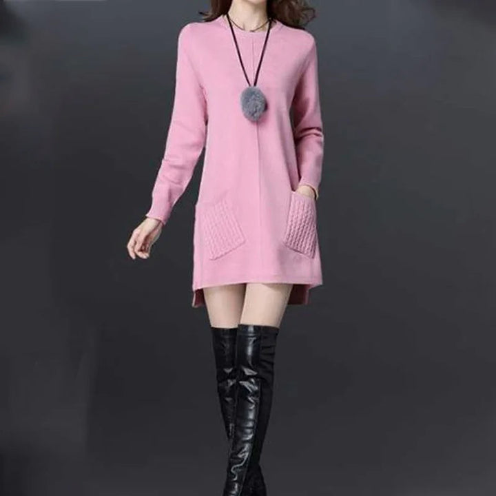Relaxed fit women's longline sweater dress with practical pockets & chic button detail for everyday wear.