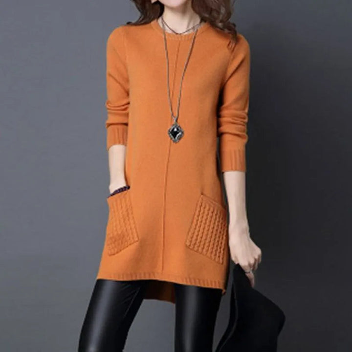 Chic women's longline sweater dress with a relaxed fit, knit texture, button detail, and pockets.