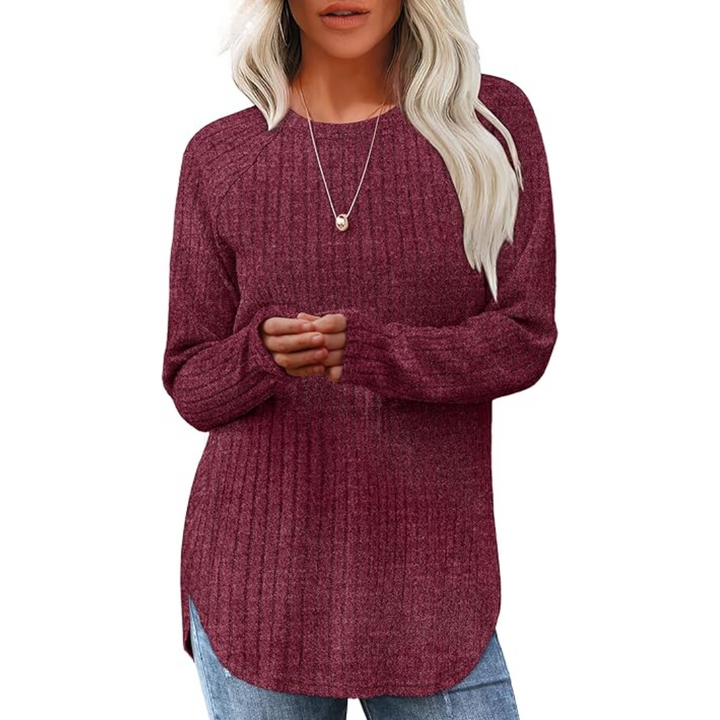 Overhead view of a women's loose fit crew neck long sleeve sweater tunic