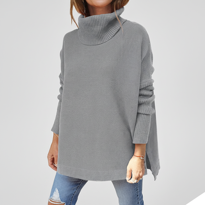 Close-up of knit texture on a women's loose fit turtleneck sweater, comfortable style