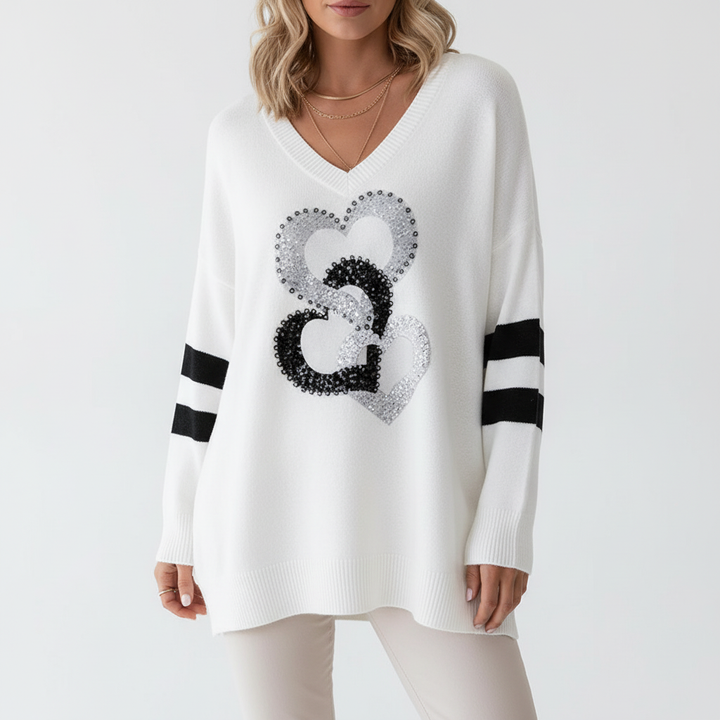 Autumn fashion essential: women's loose V-neck heart knit sweater, offering comfort and style.
