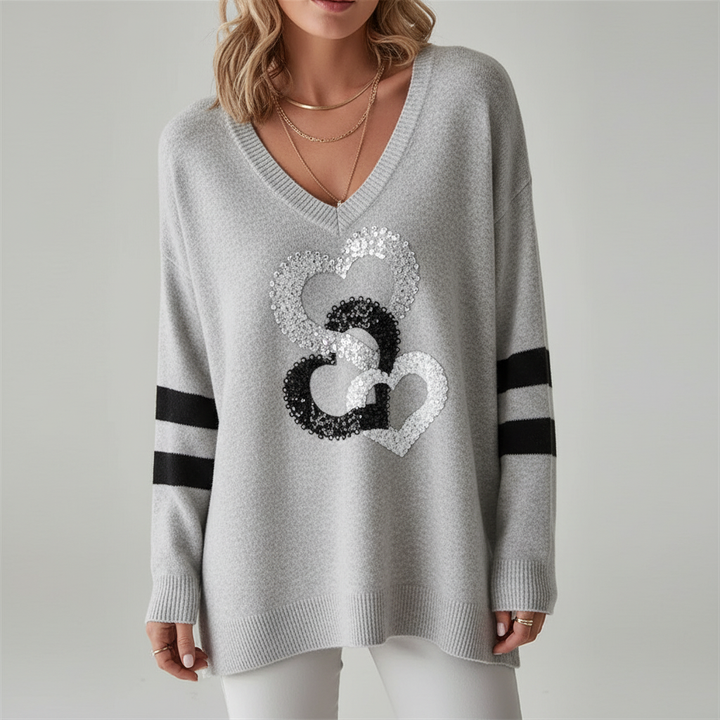 Warm winter wear: women's V-neck sweater with an elegant heart knit, loose and comfortable.