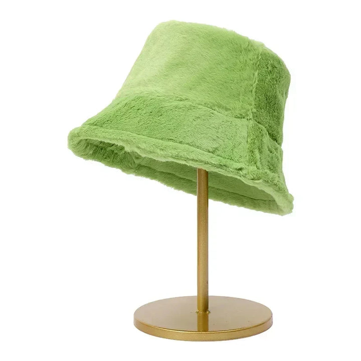 Plush faux fur bucket hat, designed for women seeking warmth and style this winter.