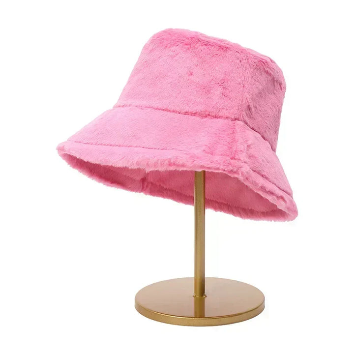 Cozy women's winter hat: a stylish faux fur bucket design for cold days.