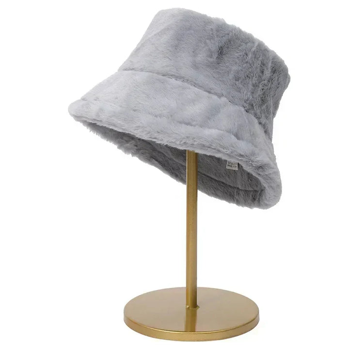 Warm & stylish women's faux fur bucket hat, perfect for outdoor winter activities.
