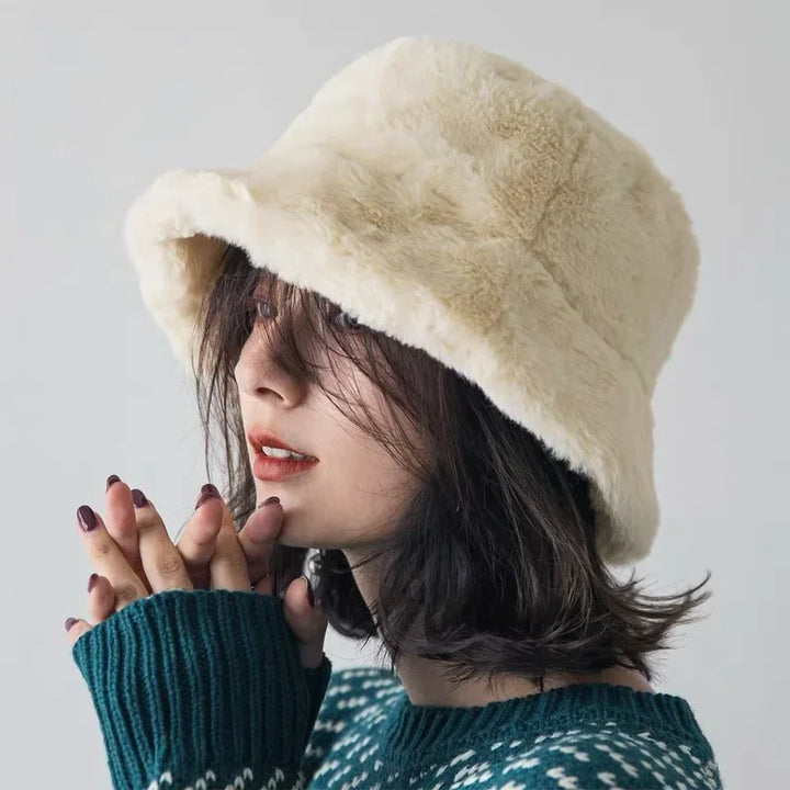 Luxurious faux fur bucket hat for women, a soft and warm autumn/winter accessory.