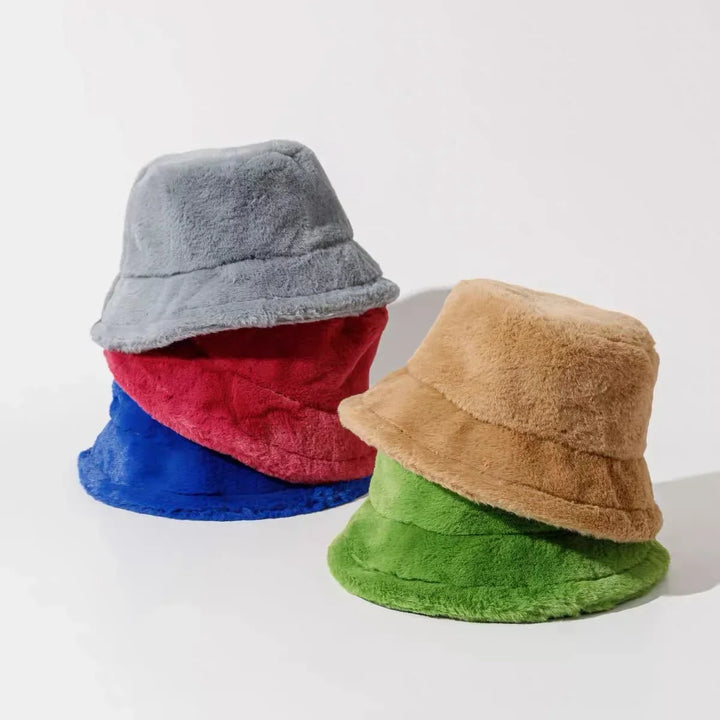 Women's fashionable faux fur bucket hat, offering warmth and a chic look.