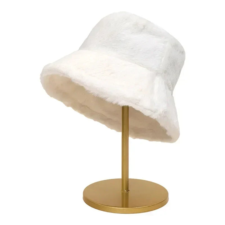 Chic women's faux fur bucket hat, a fashionable and warm winter accessory.