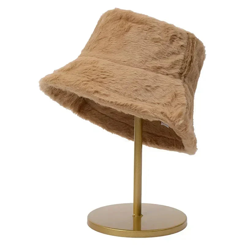 Cozy women's faux fur bucket hat, an essential stylish winter fashion piece.