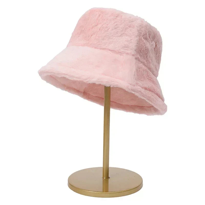 Elegant women's faux fur bucket hat, a plush winter fashion statement accessory.