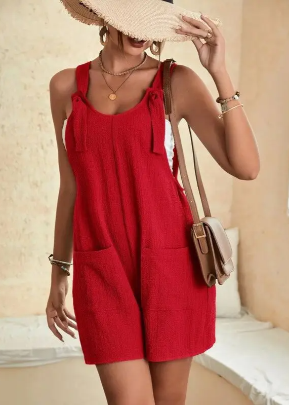 Chic women's effortless lounge romper with adjustable straps, versatile for casual or resort style.