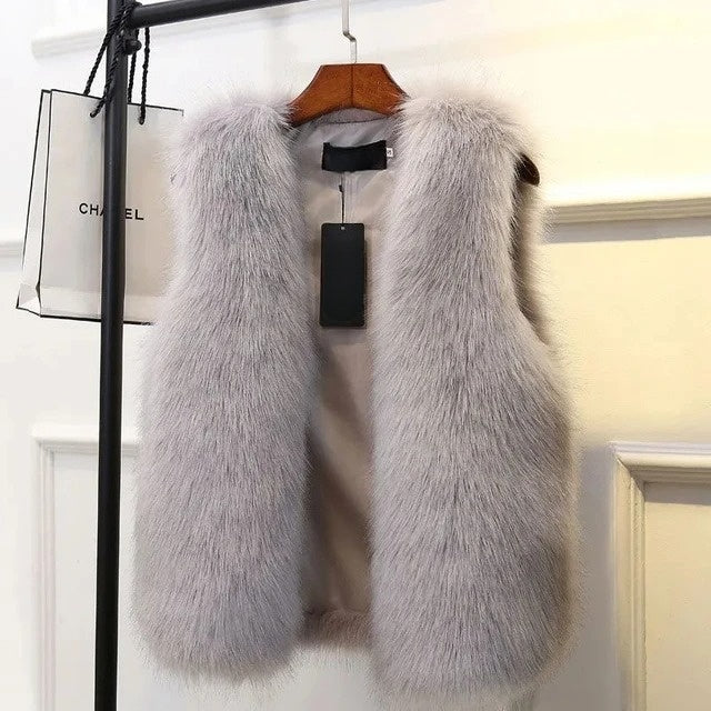 Women's Lucent faux fox fur gilet vest. Luxurious, warm, and chic outerwear for elegant winter style.