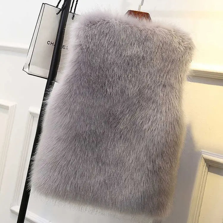 Chic women's faux fur gilet vest in Lucent for stylish layering. Modern silhouette & cozy warmth.