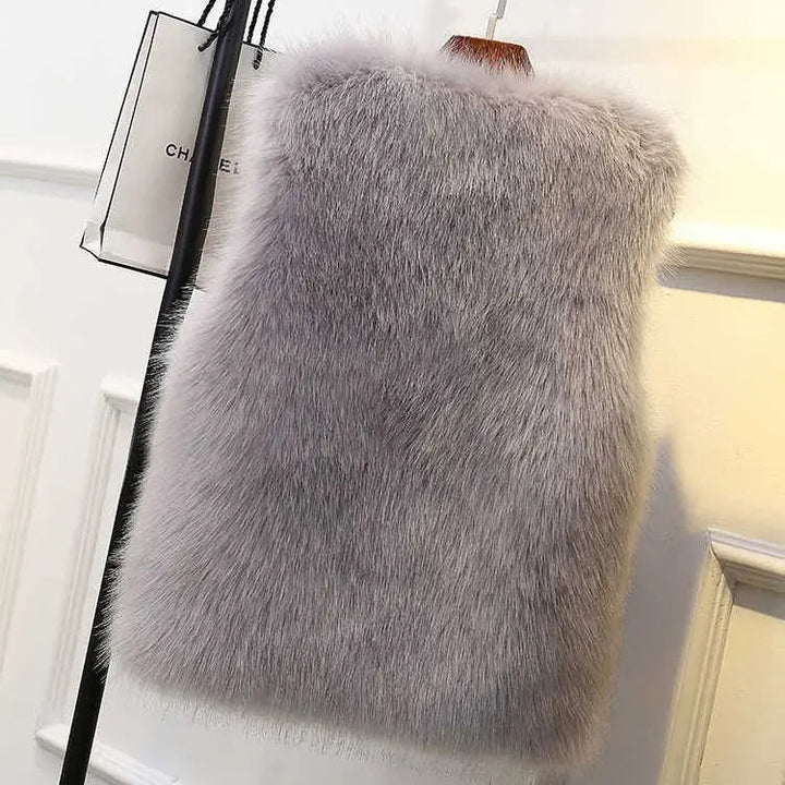 Chic women's faux fur gilet vest in Lucent for stylish layering. Modern silhouette & cozy warmth.
