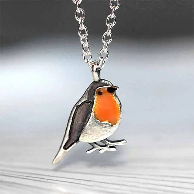 Hope symbol: Women's lucky bird pendant necklace with matching stud earrings.