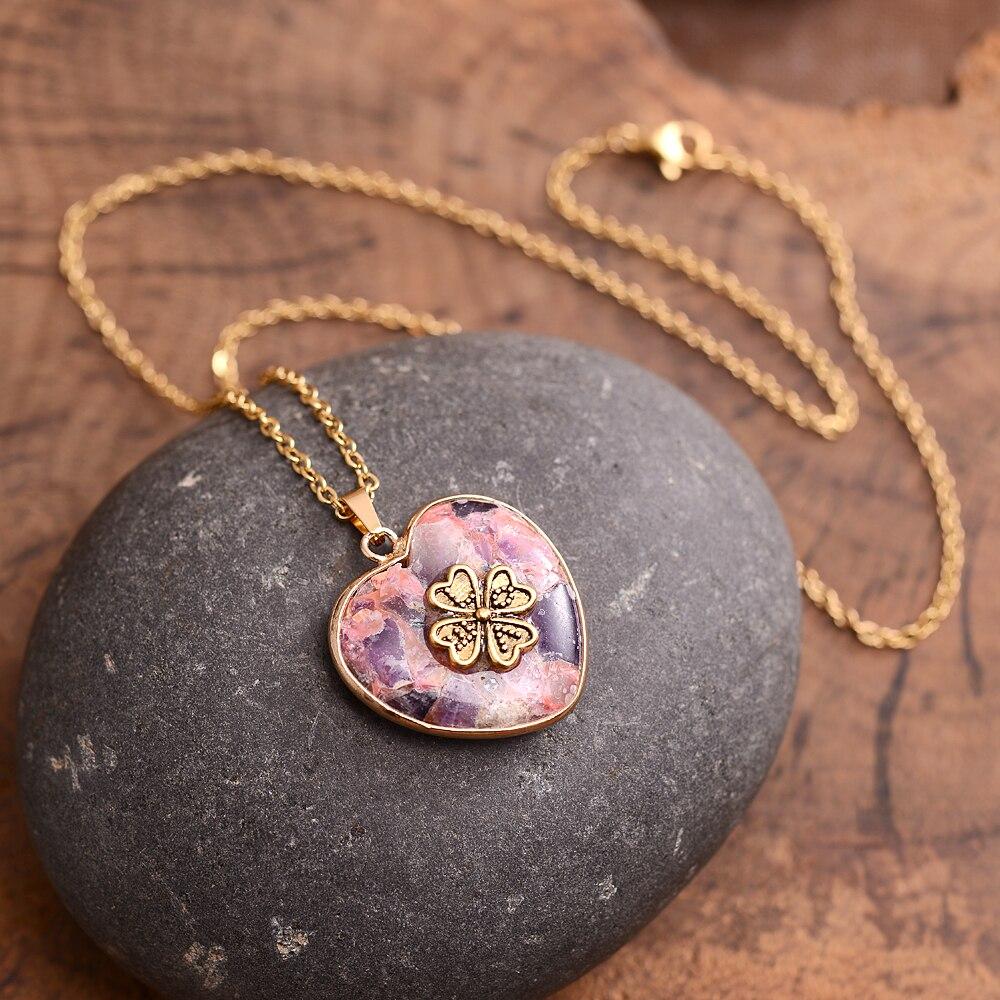 Close-up of a handmade Women's Lucky Clover Rhyolite stone necklace. Unique gemstone jewelry with positive energy.