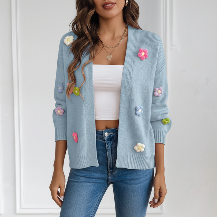 Silvia women's vest with delicate floral appliqués and an open front design