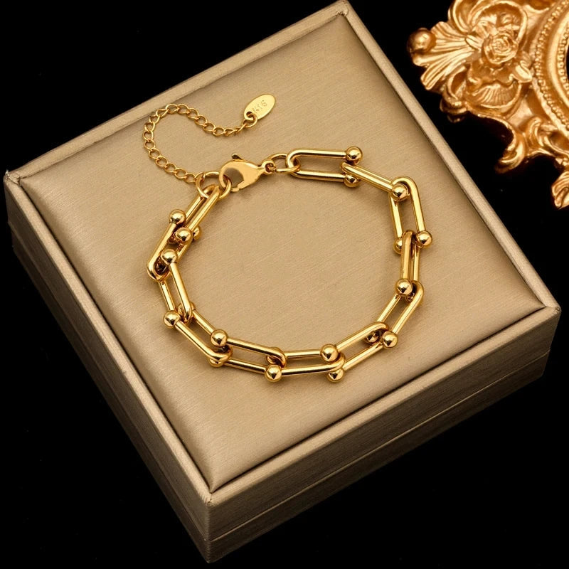 Close-up of Lumiere gold link bracelet. Elegant women's premium plated accessory, perfect gift for her.