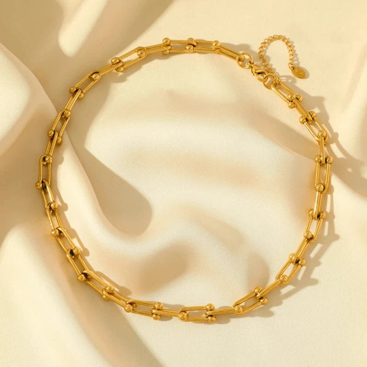 Lumiere gold link necklace & bracelet set on display. Elegant women's jewelry, ideal gift for her.