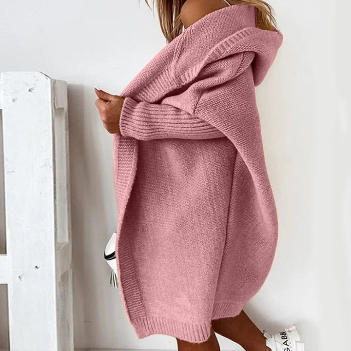 Oversized women's hooded cardigan, perfect as a cozy layer for casual autumn fashion.