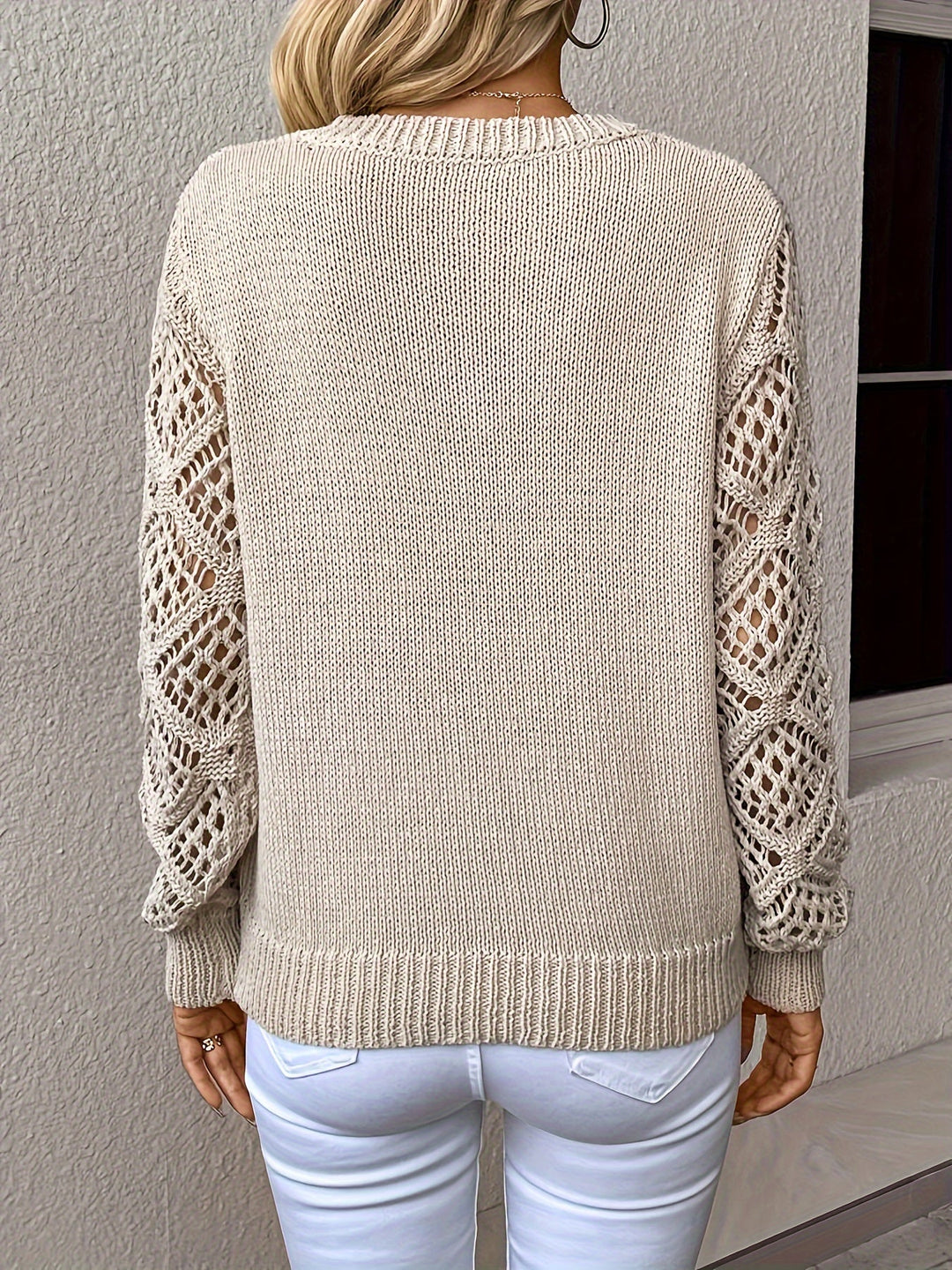 Trendy women's Luna pullover sweater featuring a unique hollow-out knit & flattering V-neck. Casual chic.