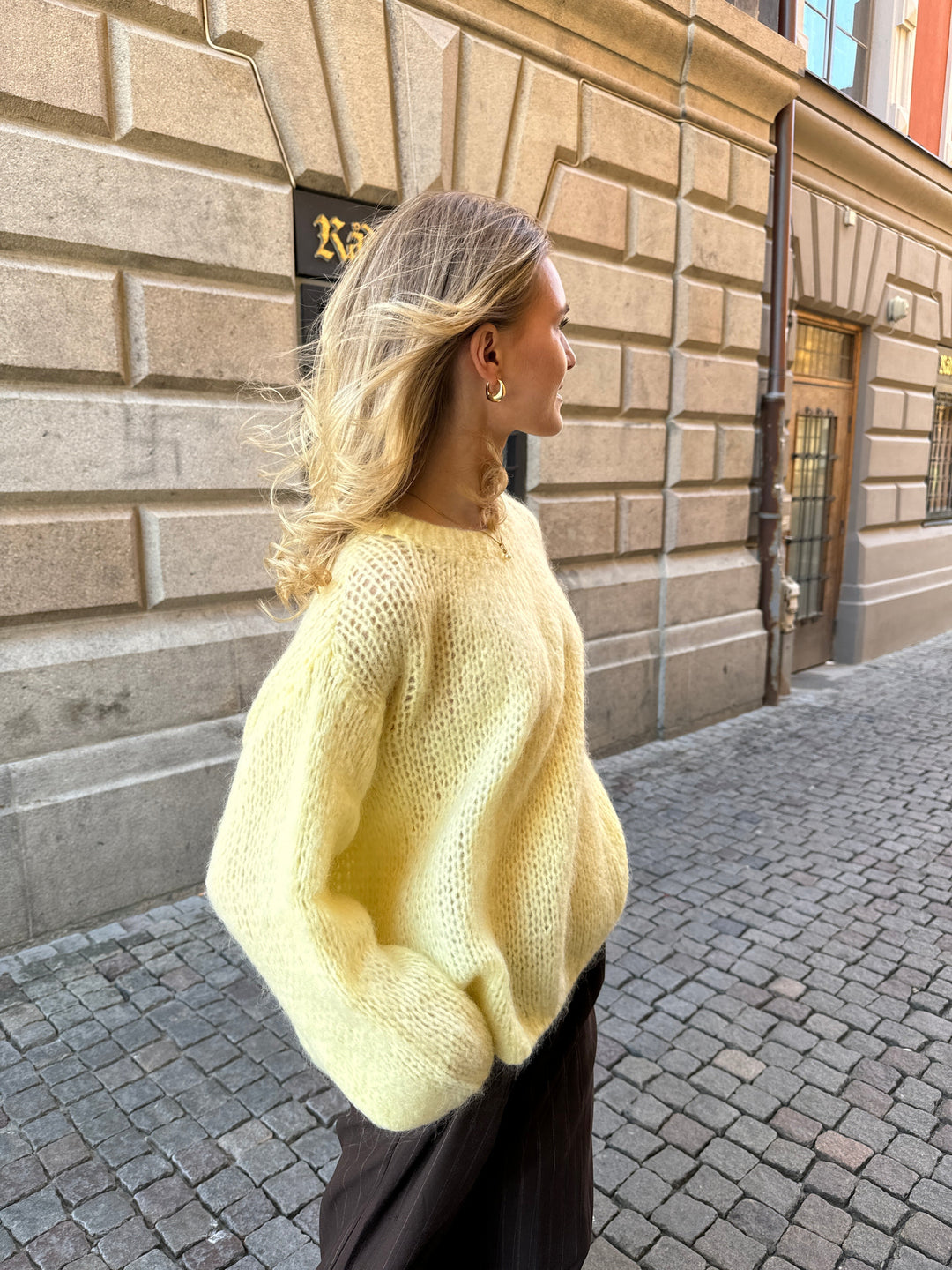 Luxury apparel: relaxed fit women's sweater, embodying chic and comfortable style.