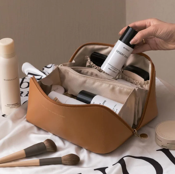 Luxe BelleVault cosmetic organizer, open, displaying multiple compartments for makeup & toiletries.
