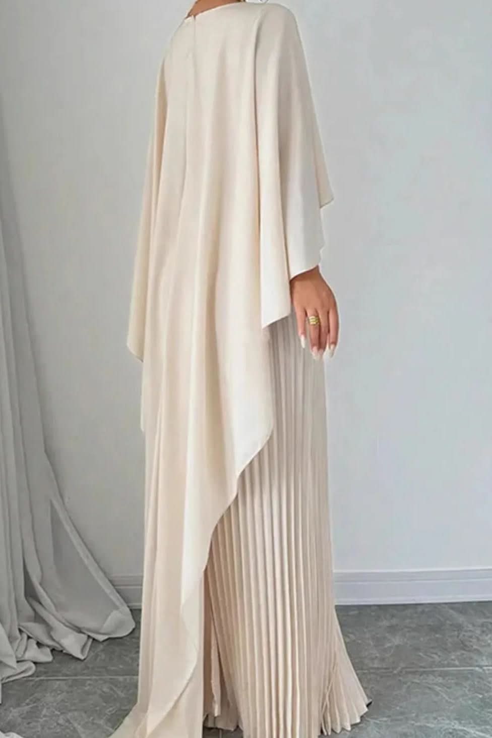 Elegant women's pleated maxi dress with flowing cape detail, ideal for special occasions & evening wear.