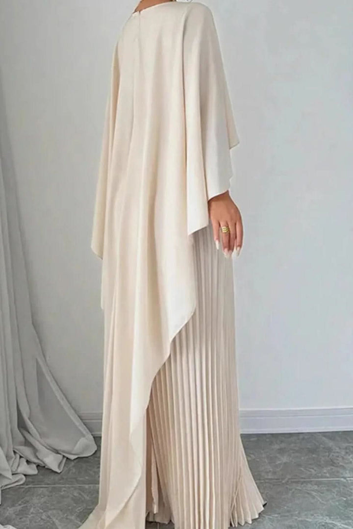 Elegant women's pleated maxi dress with flowing cape detail, ideal for special occasions & evening wear.