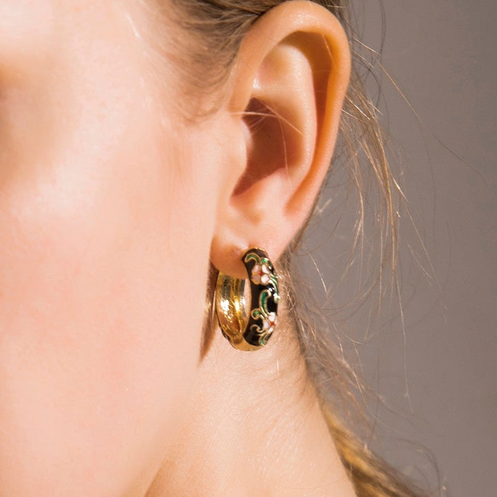 Detailed close-up of Roselle Luxe floral drop earrings for women, silver fashion accessory