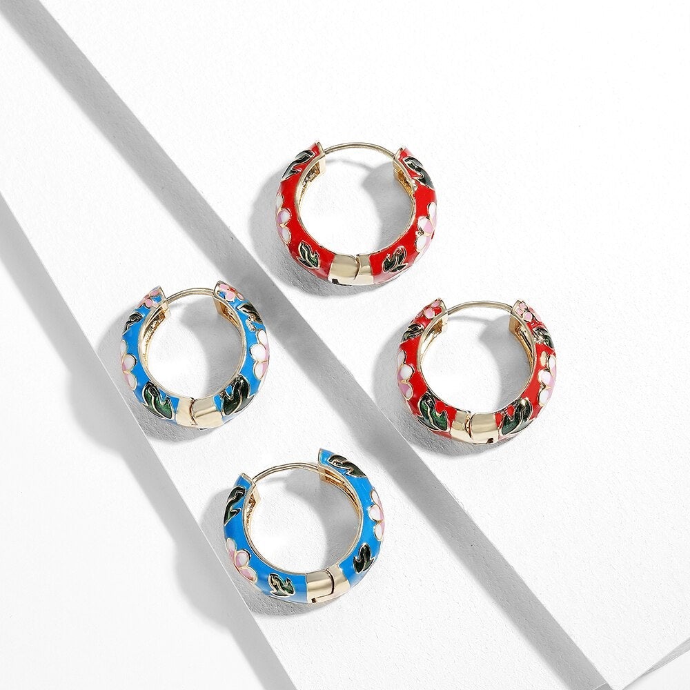 Pair of Roselle Luxe floral drop earrings, showcasing intricate silver design for women