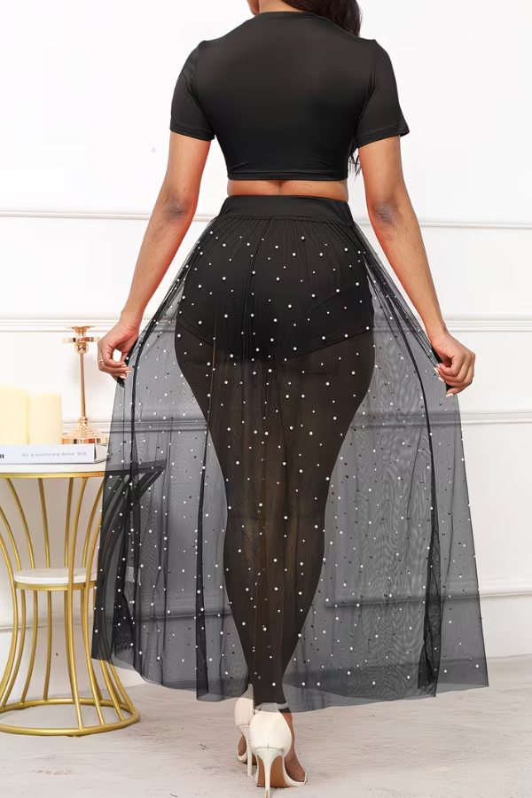 Sophisticated women's three-piece beach set for resort & vacation. Crop top, sheer skirt, pearl accents.