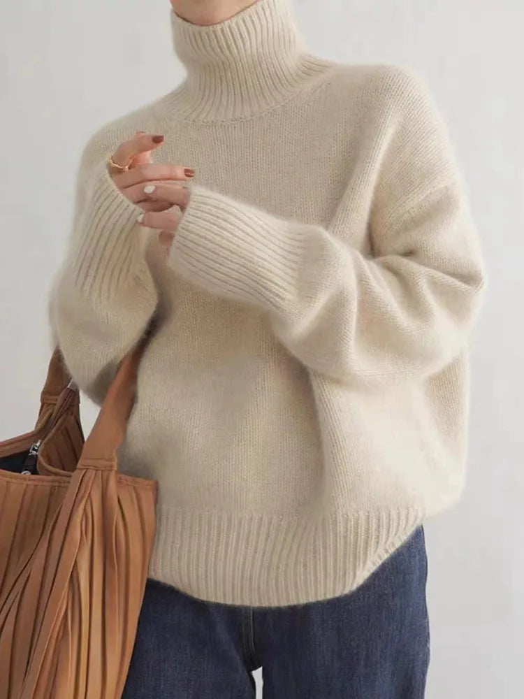 Women's luxurious cashmere turtleneck sweater in an elegant shade. Soft, cozy, and perfect for sophisticated winter fashion.
