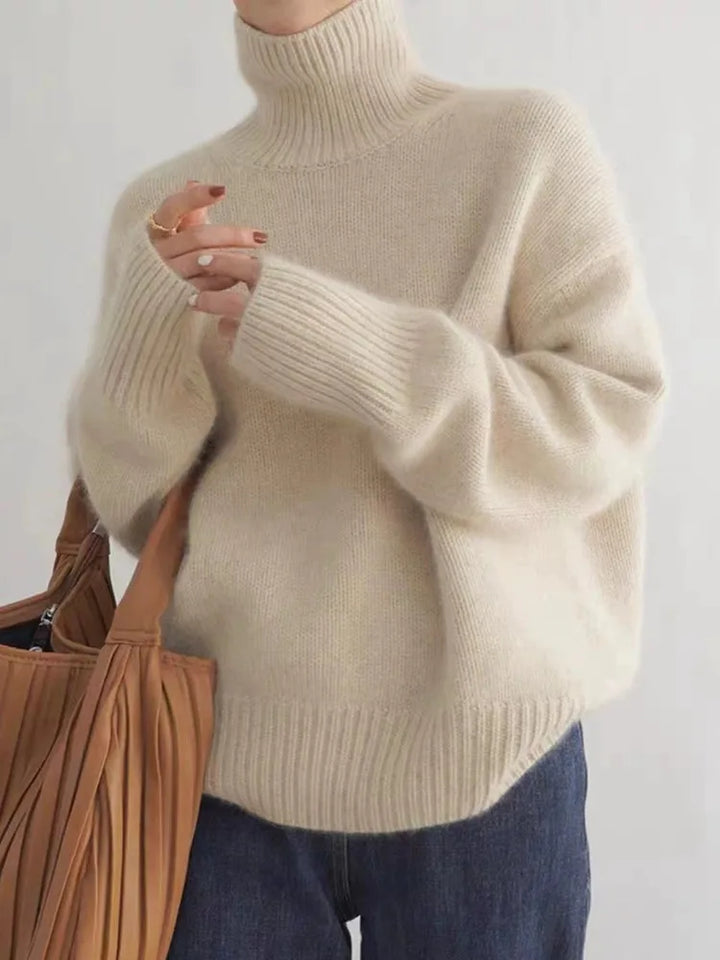 Women's luxurious cashmere turtleneck sweater in an elegant shade. Soft, cozy, and perfect for sophisticated winter fashion.