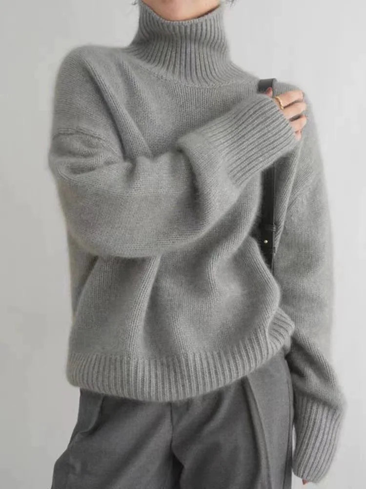 Cozy women's pure cashmere turtleneck sweater, a soft and luxurious knit top for ultimate winter comfort and elegance.