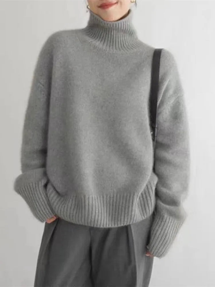 Stylish women's cashmere turtleneck sweater. A luxurious knit pullover, perfect for elegant fall and winter fashion.