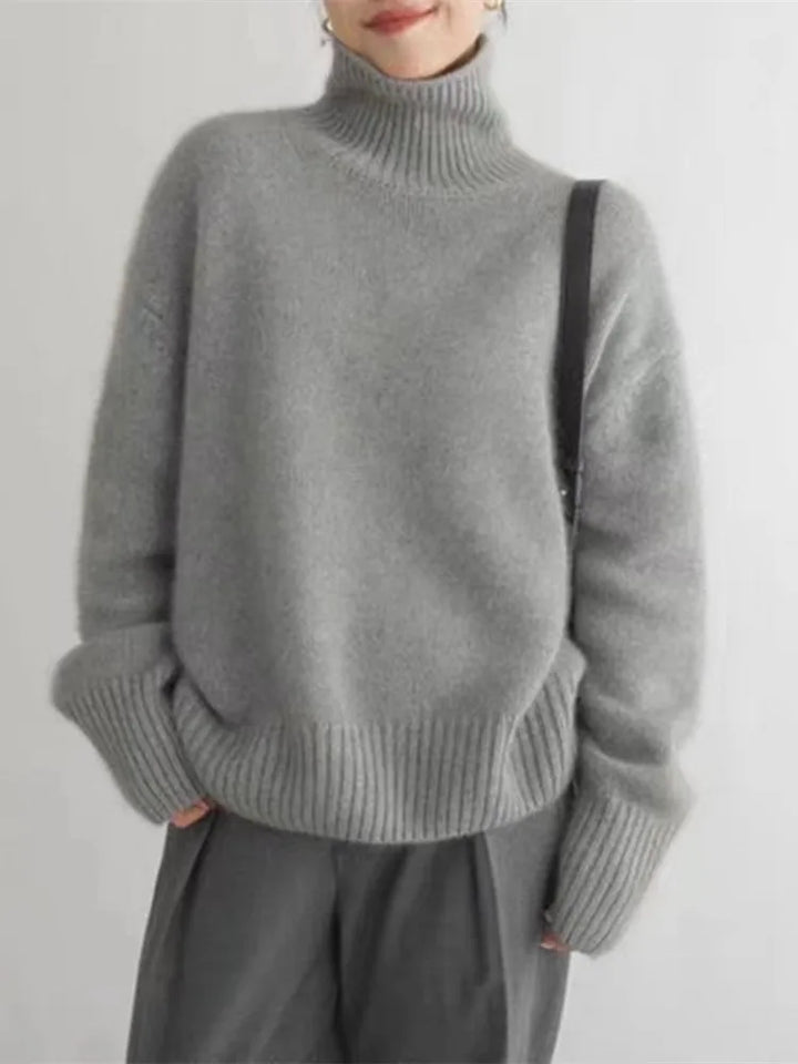 Stylish women's cashmere turtleneck sweater. A luxurious knit pullover, perfect for elegant fall and winter fashion.