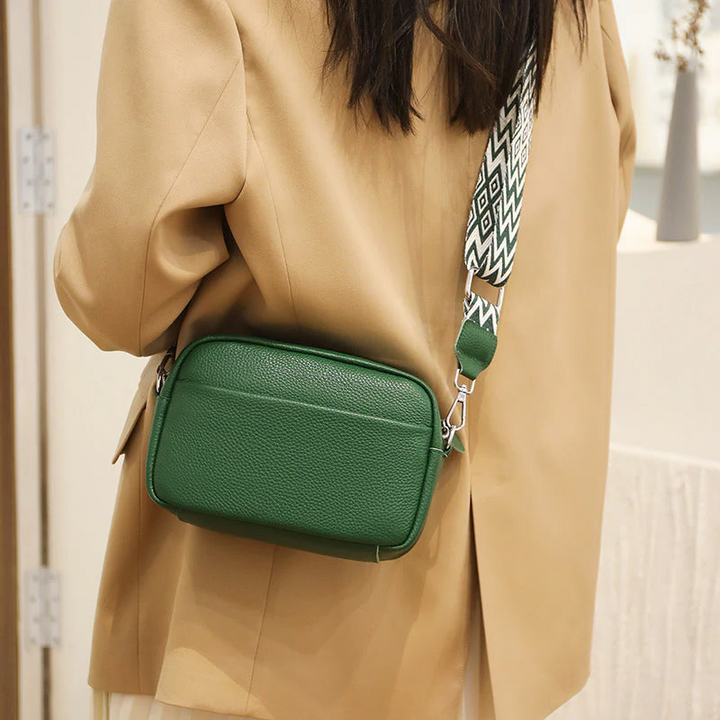Elegant Black Genuine Leather Crossbody Bag. Luxurious women's daily accessory.