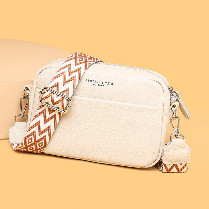Versatile genuine leather shoulder bag. Women's stylish daily handbag in luxury cowhide.