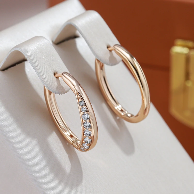 Women's luxurious gold zirconia stud earrings, elegant & sparkling, perfect for special occasions.