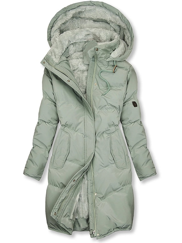 Luxuriously warm women's insulated winter jacket, a long stylish coat for ultimate cold weather comfort.