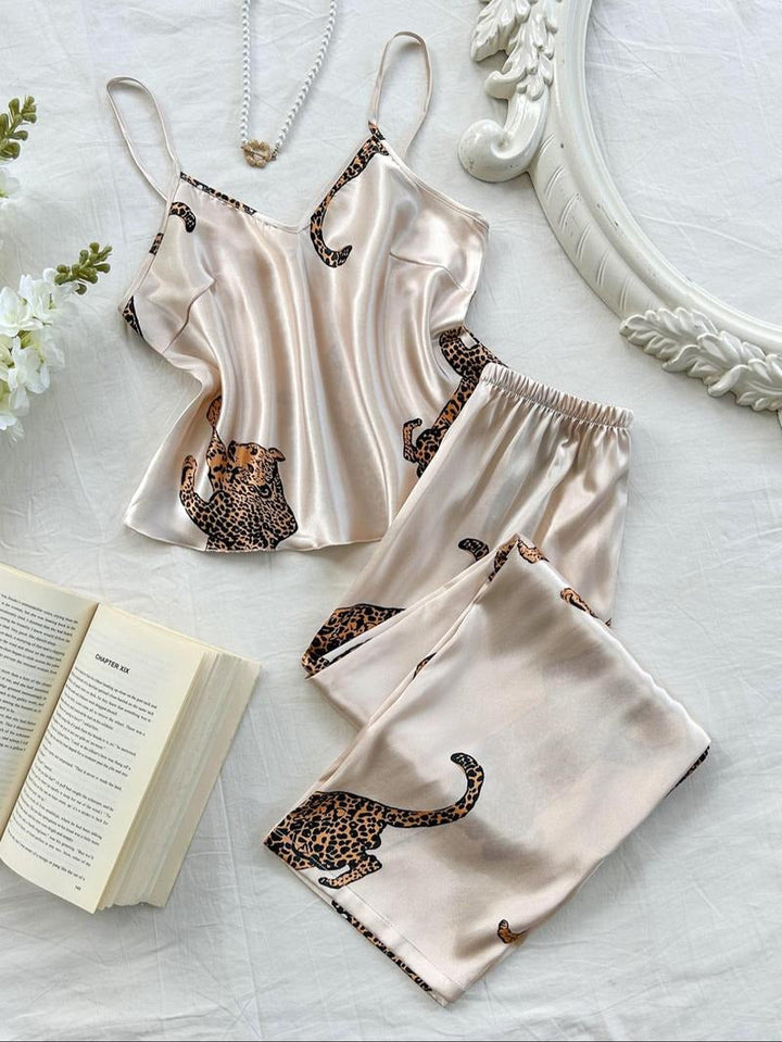 Women's luxurious leopard print silk pajama set. Comfortable animal print loungewear for stylish sleep.