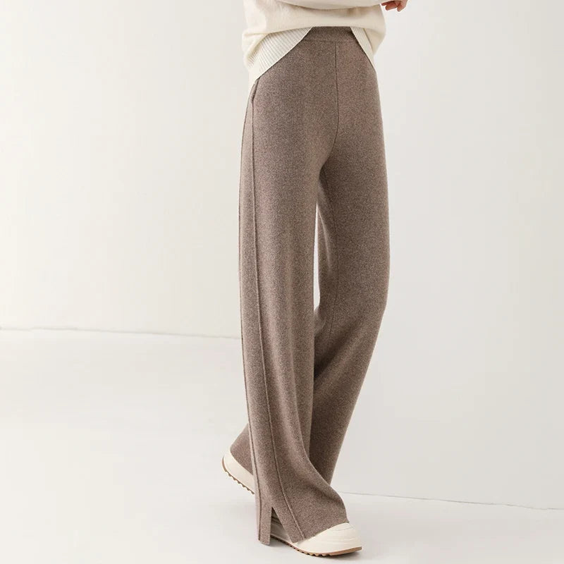 Comfortable women's merino wool pants with stylish side slit, ideal for luxury winter style.