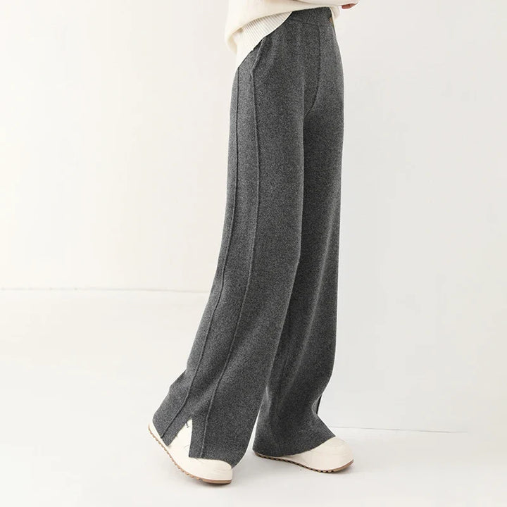 Close-up of soft merino wool texture on women's luxurious relaxed fit trousers.