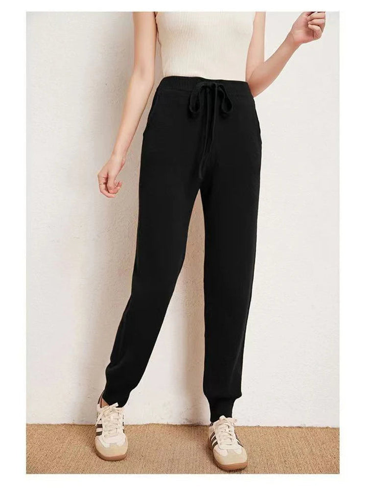 Cozy women's loungewear joggers featuring an adjustable drawstring waist and ribbed cuffs for a snug fit.